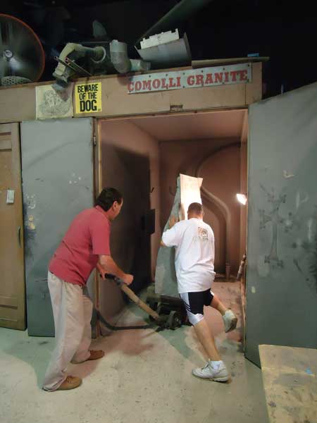 barry and andrew move the granite to the sandblasting chamber.